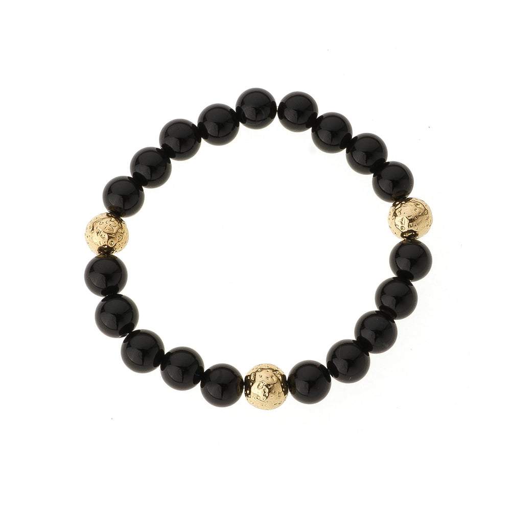 Onyx & Triple Gold Bead Elastic Bracelet on white